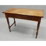 A Victorian walnut side table, the rectangular top above two frieze drawers, on turned tapering legs