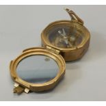 A reproduction brass nautical compass, 7cm wide