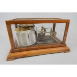 A Negretti and Zambra barograph, in a mahogany glazed case, no.R/38556, 35cm wide. Provenance: