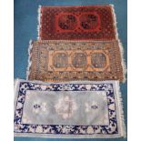 Two Afghan rugs, each with a design of medallions, on an orange ground, 130cm x 76cm, and 140cm x