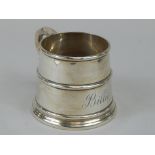 A late Victorian Christening mug, of tapering form, with shaped handle in early 18thC style,