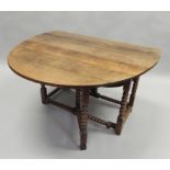 An 18thC oak oval gateleg table, on bobbin turned supports, 106cm wide.