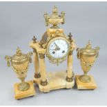A 19thC French clock garniture, the central clock with a white enamel dial, painted with swags, on