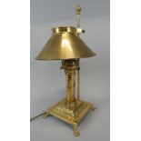 A reproduction brass Orient Express table lamp, with shade, 46cm high Provenance: Butterfields,