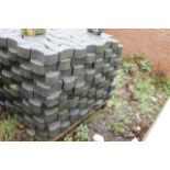 A quantity of heavy duty concrete interlocking pavers.