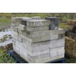 A quantity of concrete breeze blocks.