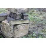 A quantity of sandstone blocks, in various sizes.