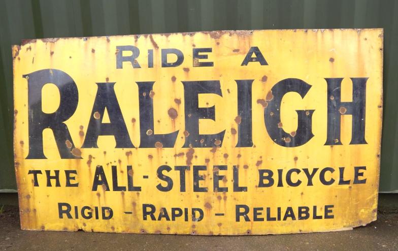 A Raleigh enamel sign, Ride A Raleigh, The All-Steel Bicycle, Rigid-Rapid-Reliable, Sells Ltd, black