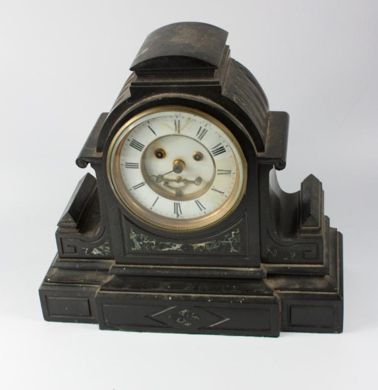 A French late 19thC slate and green veined marble mantel clock, of architectural form, enamel dial