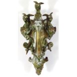 A mid-19thC cast metal Cerberus door knocker, of shaped outline with articulated tear drop centre