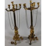 A pair of early 19thC gilt metal candelabra garniture, each set with six dish holders with urn