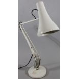 A 20thC Bauhaus design angular table lamp, with articulated metal stem, shaped shade and circular