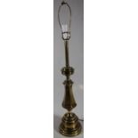 An American mid 20thC brass table lamp, the elaborate cylindrical stem on baluster column and