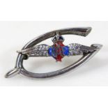 A mid 20thC RAF brooch, on a wish bone back with enamel and painted winged centre, marked metal, 4cm