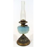 A late Victorian oil lamp, with clear glass funnel, frosted blue glass textured reservoir and