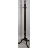 An early 20thC mahogany lamp standard, with baluster and cylindrical column on triple supports