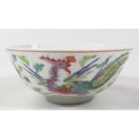 A Chinese porcelain bowl, the circular body polychrome decorated with flowers and exotic birds,