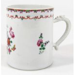 A late 18thC Chinese export cider tankard, decorated with flowers in a famille rose palette with