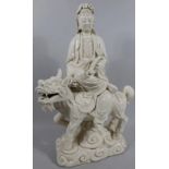 A 20thC Chinese semi porcelain blanc-de-chine figure, of a lady in flowing robes holding sceptre, on