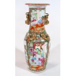 A 19thC Cantonese vase, the trumpet shaped stem and shouldered body typically decorated with