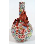 A highly decorative Chinese porcelain Kangxi style vase, with cylindrical stem and bulbous body,