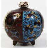 A Chinese cloisonné lidded bowl, decorated with panels of flowers predominantly in turquoise, red