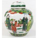 A Chinese porcelain Kangxi style ginger jar, the shouldered body and domed lid decorated with