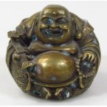 A late 19th/early 20thC Chinese bronze Buddha figure, in typical seated jovial position holding