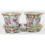 A pair of Cantonese Qing period famille rose planters, each hexagonal body on stand, typically