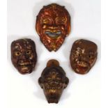 A 19thC wall death mask, of small proportion, 13cm high, the figure with gaping mouth, teeth and