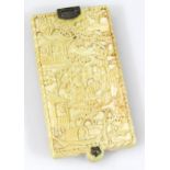 A late 19thC Chinese ivory notebook, of rectangular outline, heavily carved with figures with a