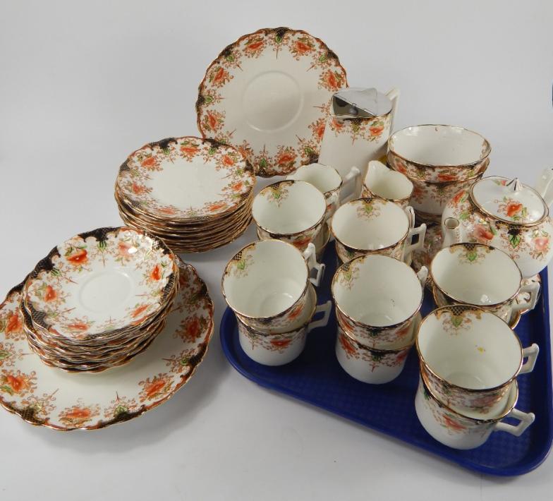 A Wellington China late 19thC pottery tea service, decorated in the Alton pattern, comprising teapot