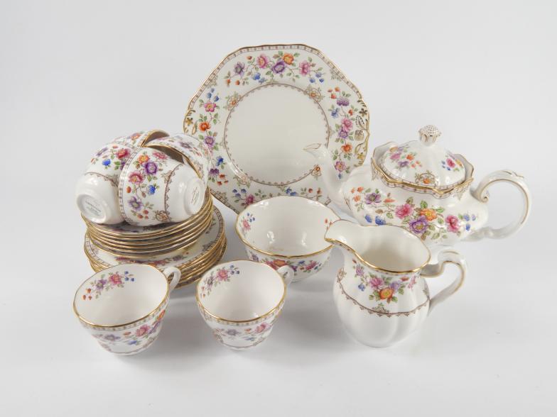 A Spode porcelain part tea service, decorated in the Lauriston pattern, comprising teapot, cream