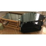 A cane coffee table, a television stand and a small single door cupboard with various books,