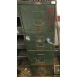 A green steel filing cabinet and contents.