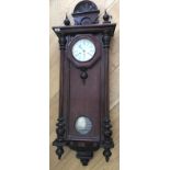 A walnut and mahogany cased wall clock, with German eight day movement.