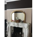 A Victorian style gilt framed overmantel mirror, ornaments and mantel clock.