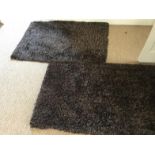 A set of four hearth rugs.