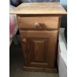 A pair of stripped pine bedside cupboards, and a silvered framed mirror, (3).