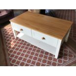 A pine top and painted two drawer coffee table.