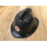 An East Sussex Fire Brigade fireman's helmet, stamped small, 51256 1984.