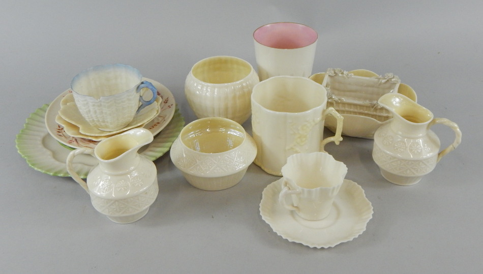 A quantity of 19thC and later Belleek porcelain, to include jugs, beakers, saucers, plates etc.