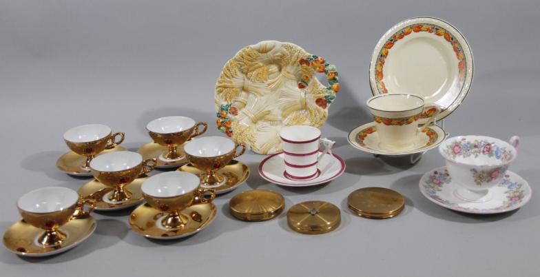 A mid 20thC gilt coloured part tea service, comprising cups and saucers, a Royal Worcester cabinet