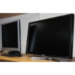 A Dell 24" colour monitor, in black, and a FP937 Benq 19" monitor. (2)