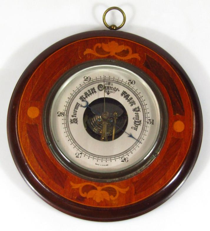 An early 20thC mahogany and marquetry circular hanging barometer, with 14cm diameter dial and