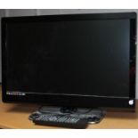 A Technika 23" colour television, in black trim.