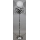 A 20thC retro standard lamp, in the form of a palm tree with bamboo stem, on domed foot, in silvered