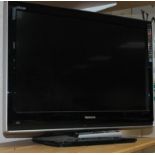 A Toshiba 32" colour television, in black trim.