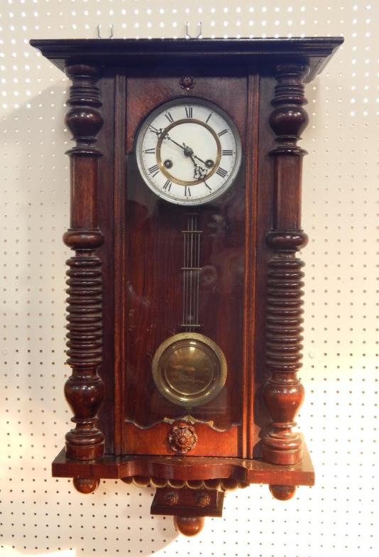 A Continental late 19thC oak and pine wall clock, white enamel dial, bearing Roman numerals, eight