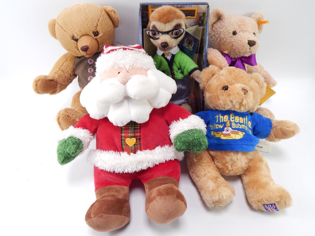 A Steiff 2016 bear, Silver Cross bear, Chad Valley Father Christmas, Yakov's Toy Shop Meerkats,